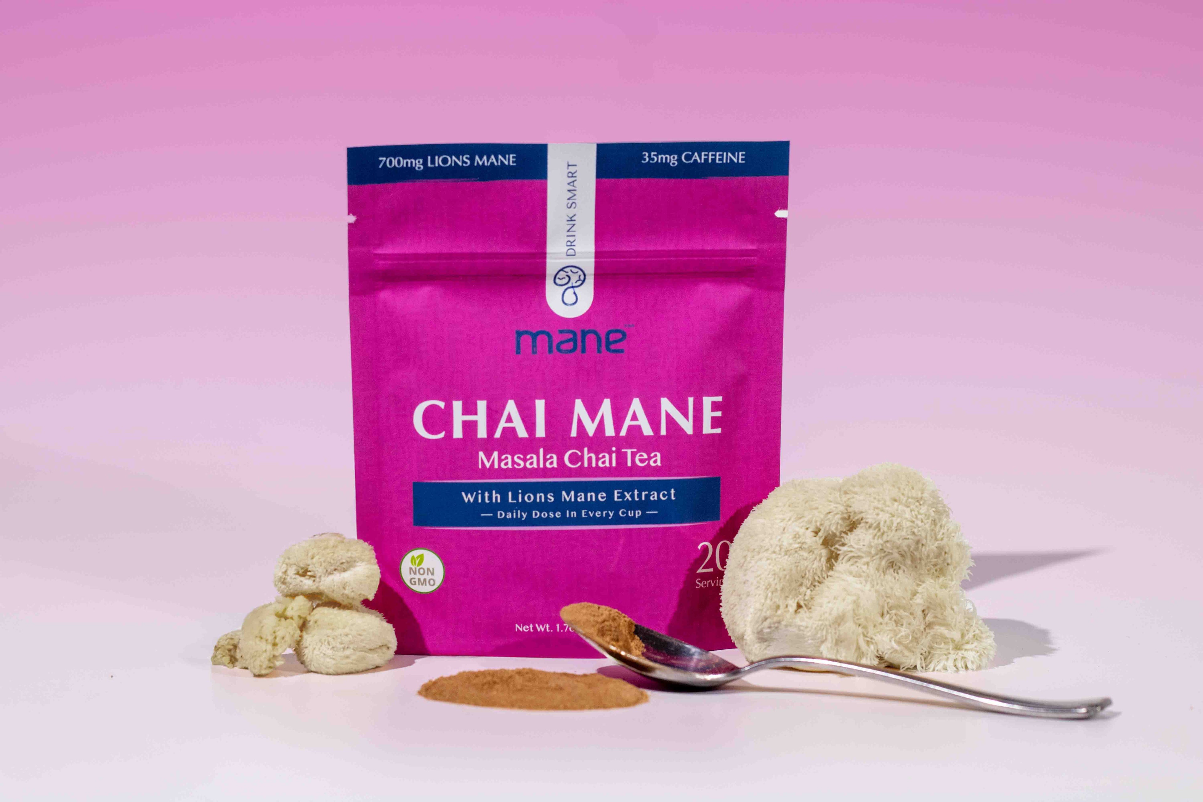 Chai Mane tea package with Lion's Mane and a spoon on a pink background
